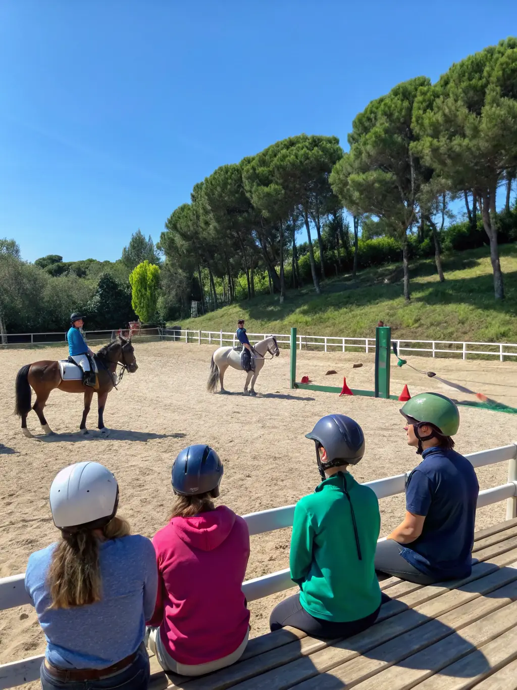 A group of young riders participating in a horseball clinic, learning the basics of the sport and developing their horsemanship skills.